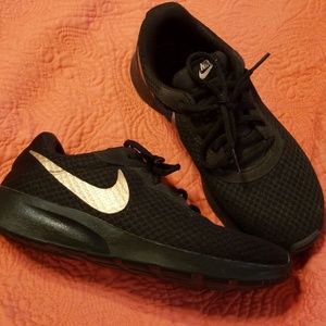 Nike Womens Tanjun black with Rose Gold Swoosh